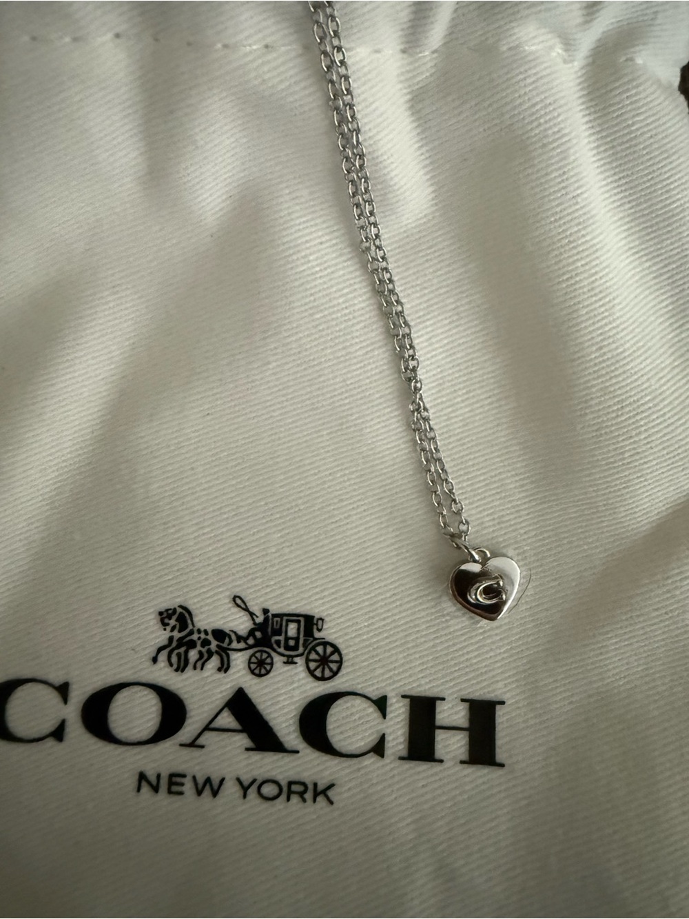 Coach Silver Heart Turnlock Pendant Necklace - Silver